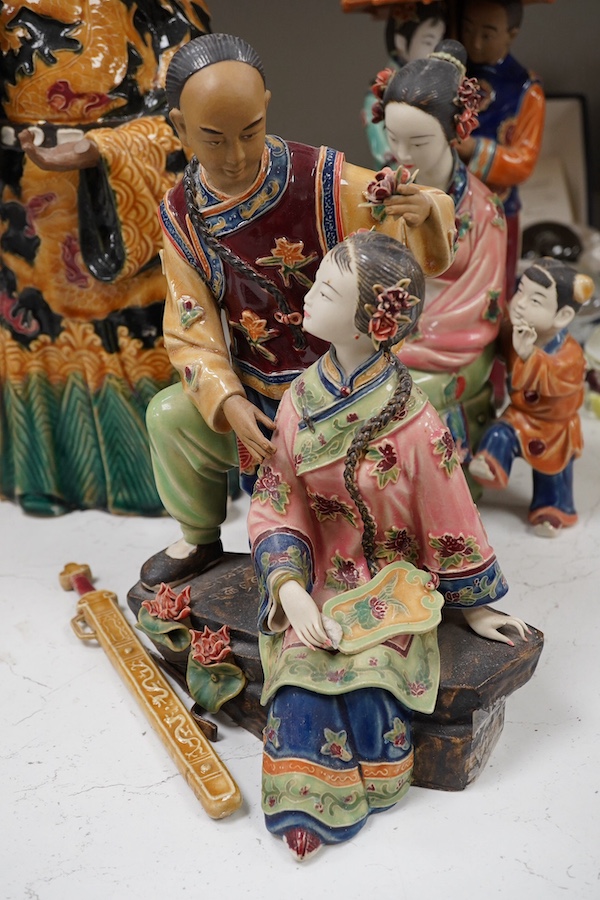 Four Chinese glazed earthenware figure groups, largest 42cm high. Condition - fair to good